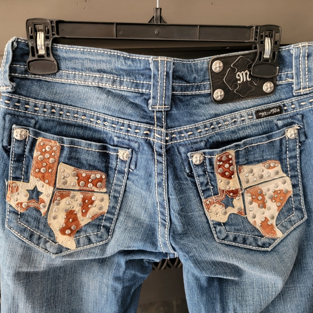 Miss Me boot cut jeans, size 28, Cow Print Texas on back pocket